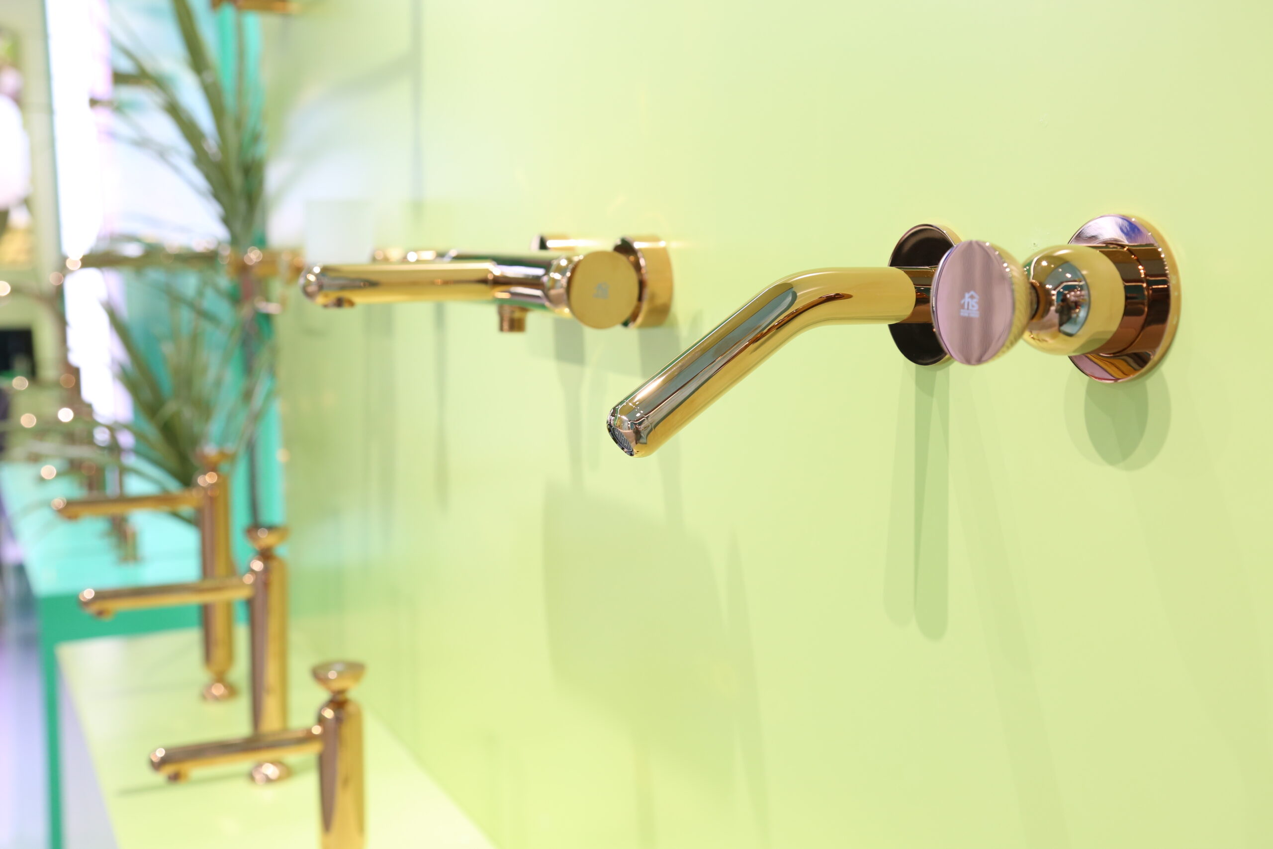 High-gloss golden Vein Series control knob close-up, reflective metal texture