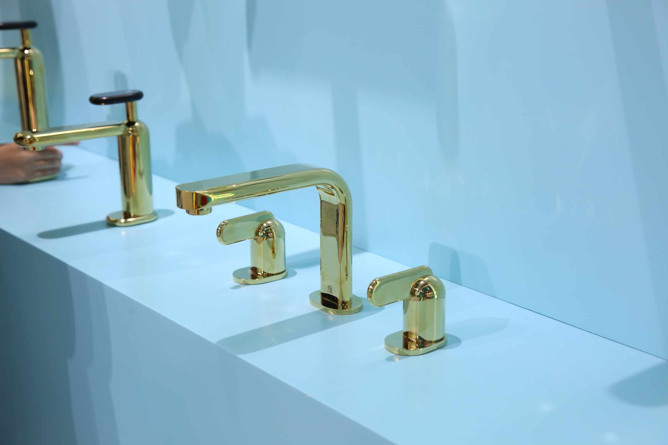 Sleek profile view of the Cobble Series basin faucet with smooth contours and premium matte black finish.