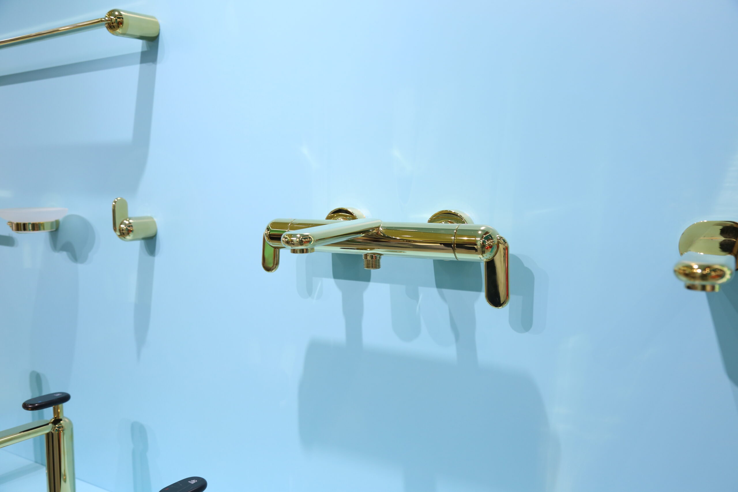 Close-up detail of the Cobble Series faucet handle and spout, revealing intricate stone-like texture and craftsmanship.